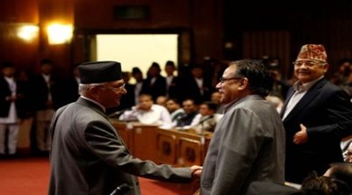 KP Sharma Oli with Pushpa Kamal Dahal. (REUTERS)