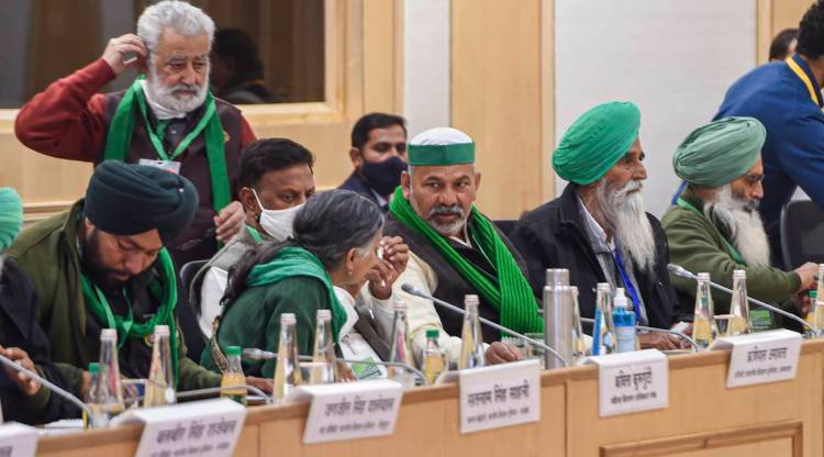 Bharatiya Kisan Union Spokesperson Rakesh Tikait (C) along with farmers leaders during a meeting with Union Minister for Agriculture & Farmers Welfare Narendra Singh Tomar (unseen) and Union Minister for Commerce and Industry Piyush Goyal (unseen) over the new farm laws, at Vigyan Bhawan in New Delhi, Wednesday, Dec. 30, 2020. (PTI Photo)
