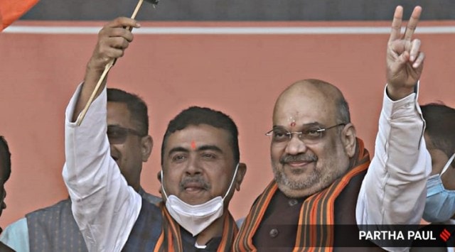 Former TMC leader Suvendu Adhikari (left) joined BJP at Shah’s rally in Midnapore on Saturday. (Express Photo by Partha Paul)