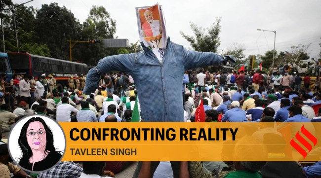 Protesting farmers hold an effigy of Prime Minister Narendra Modi during a demonstration against new farming laws in Bangalore (AP)