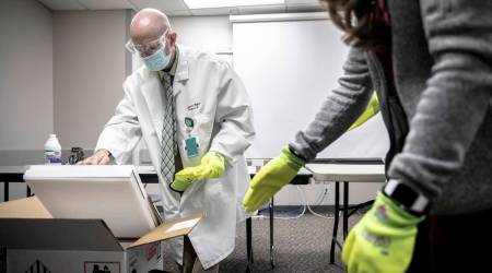 FILE -- Doses of Covid-19 vaccine arrive at a hospital in Pine Bluff, Ark., Dec. 15, 2020  (Andrea Morales/The New York Times)