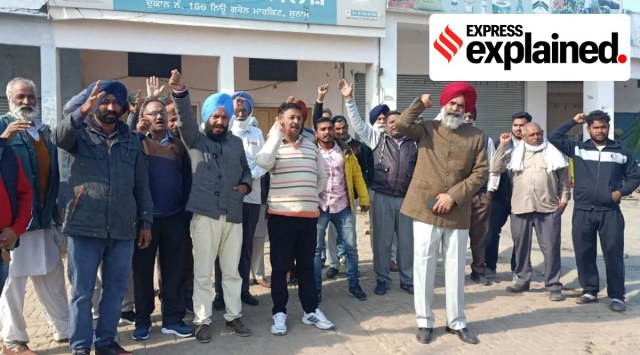 Arhityas and labourers protest against the I-T raids, at Sunam mandi on Monday. (Express Photo)