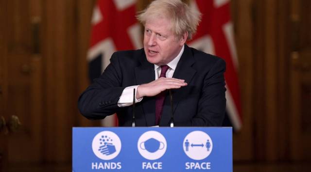 Boris Johnson tightens UK lockdown, citing fast-spreading version of virus