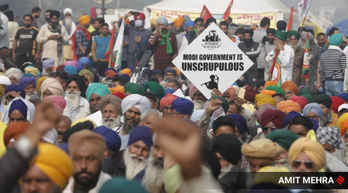 Farmers protest at Singhu border on Friday. (Express Photo By Amit Mehra)