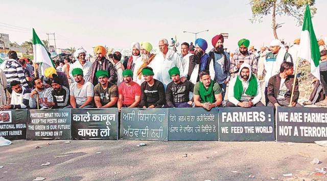 Farmers protest at Kundli border with Delhi in Haryana’s Sonepat district on Sunday. (PTI)