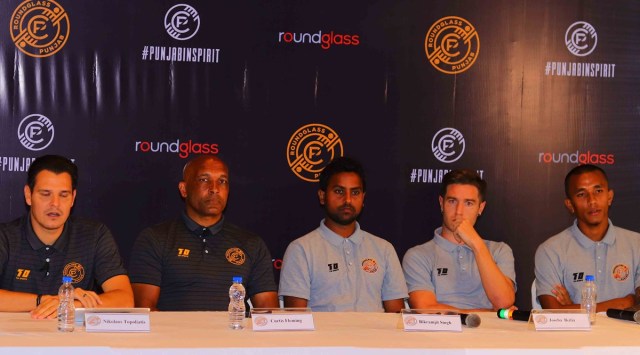 (From left) Round Glass FC technical director, Nikolaos Topoliatis, head coach Curtis Fleming, Bikramjeet Singh, Joseba Beitia, and Bikash Yumnam during the jersey unveiling of the club at Kolkata. (Express Photo)  