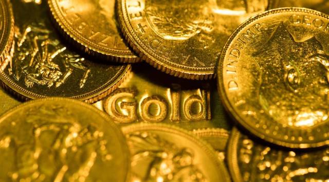 A pile of Sovereign gold coins in London, UK (Photographer: Chris Ratcliffe/Bloomberg)