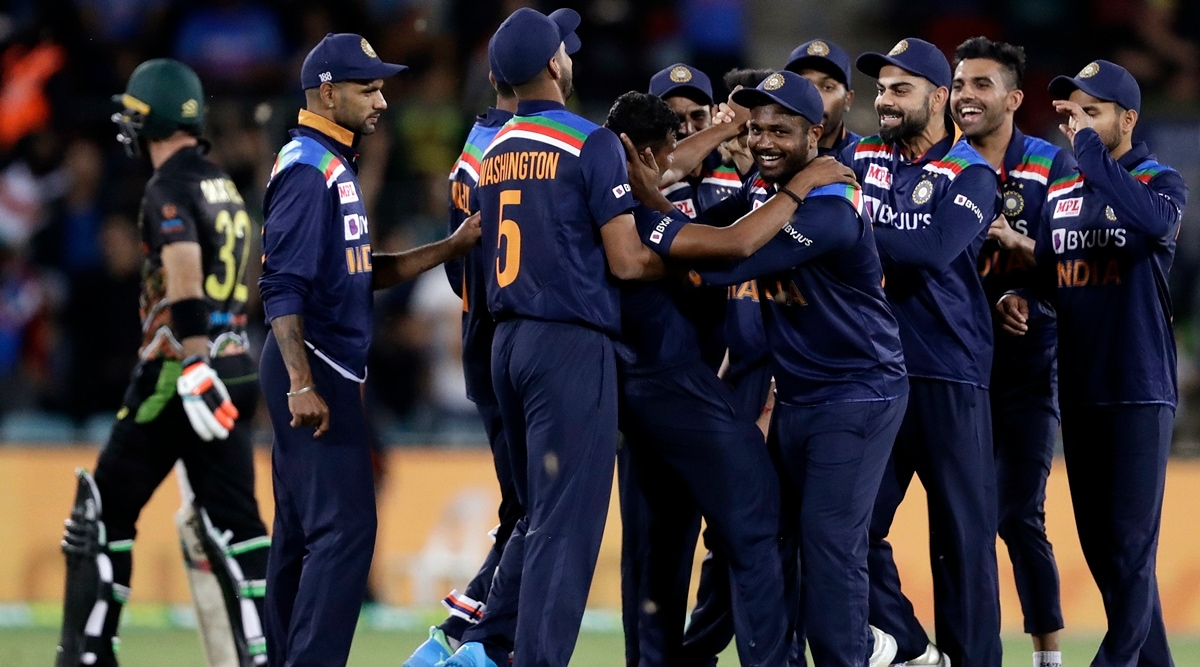 Indian teammates celebrate the wicket of Australia's Glenn Maxwell during their T20 international cricket match at Manuka Oval. (AP)