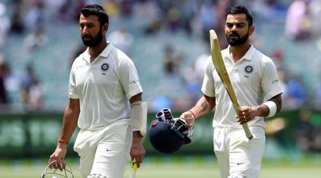 Virat Kohli (R) and Cheteshwar Pujara (L) in action during a Test. (File)
