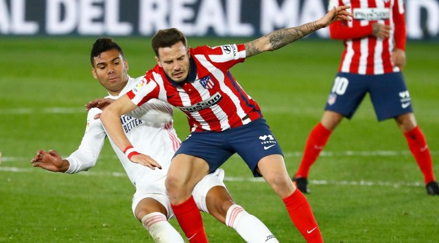 Real Madrid's Casemiro in action with Atletico Madrid's Saul Niguez. (Reuters)