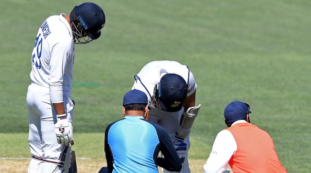 India's Mohammed Shami is attended to by medical staff after he was struck on the forearm on the third day of their cricket test match against Australia at the Adelaide Oval in Adelaide (Source: AP)