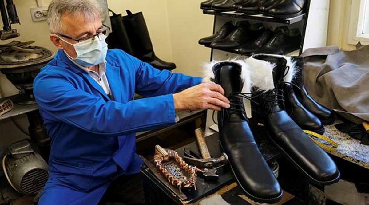 Romania, cobbler, Romania viral story, Romanian cobbler designs size-75 winter boots to stamp out COVID-19, coronavirus, shoes, trending, indian express, indian express news