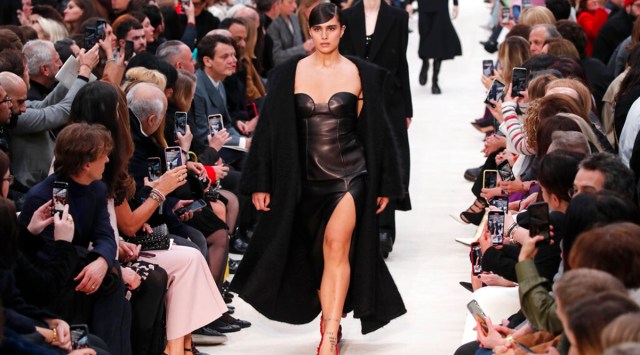 Ending the confusion over the fate of Paris Fashion Week, French fashion's regulatory body has said that this month's Paris men's and haute couture fashion shows will be strictly audience-free over coronavirus fears. (Photo: AP)
