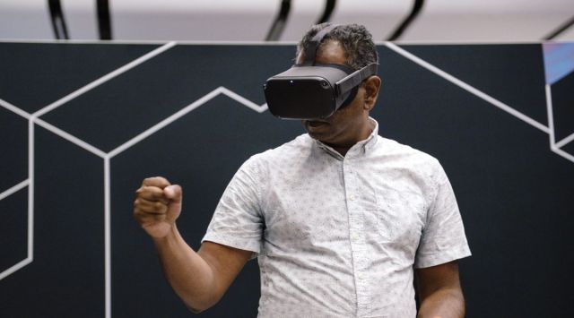 As a mostly virtual reality device, Apple's first headset will display an all-encompassing 3-D digital environment for gaming, watching video and communicating.   (Image Source: Bloomberg)