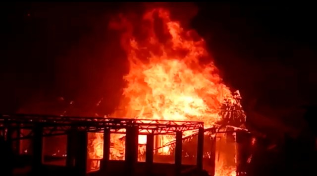 A building burns during a fire outbreak in Rohingya refugee camp, in Cox's Bazar, Bangladesh January 14, 2021 in this still image obtained from a video. (Mohammed Arakani/Handout via Reuters)
