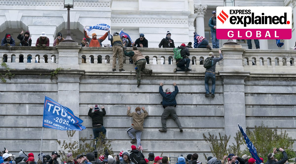 Supporters of President Donald Trump climb the west wall of the the US Capitol on Wednesday, Jan. 6, 2021, in Washington. (AP Photo: Jose Luis Magana)