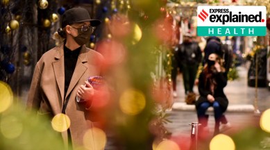 Shoppers wear face masks at the Burlington Arcade in London, Tuesday, Dec. 22, 2020. Britain's government has imposed new restrictions across many regions, in an effort to restrict the spread of the new mutant coronavirus variant during Christmas festivities. (AP Photo: Alberto Pezzali)