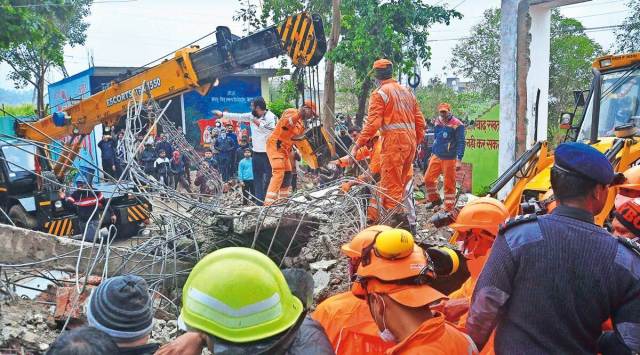 Rescue workers at the site in Muradnagar on Sunday. (PTI photo)