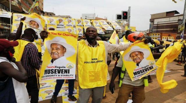 A polling agent from the National Resistance Movement (NRM) party celebrates the victory of Uganda's President Yoweri Museveni in the concluded general elections in Kampala, Uganda January 16, 2021. REUTERS/Baz Ratner
