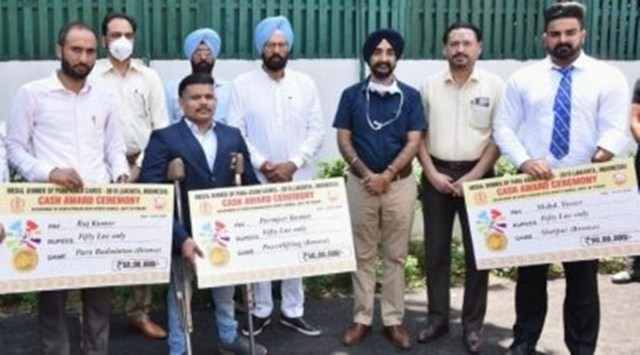 On the left Raj Kumar, a resident of Sanour village in Patiala who won silver medals in doubles and mixed doubles para badminton category in 2014 Asian games. (Express Photo) 