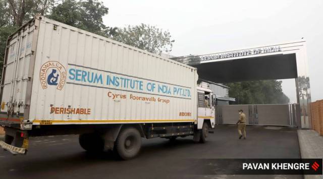 Trucks enter the Serum Institute of India premises in Pune on Saturday morning. (Express photo by Pavan Khengre)