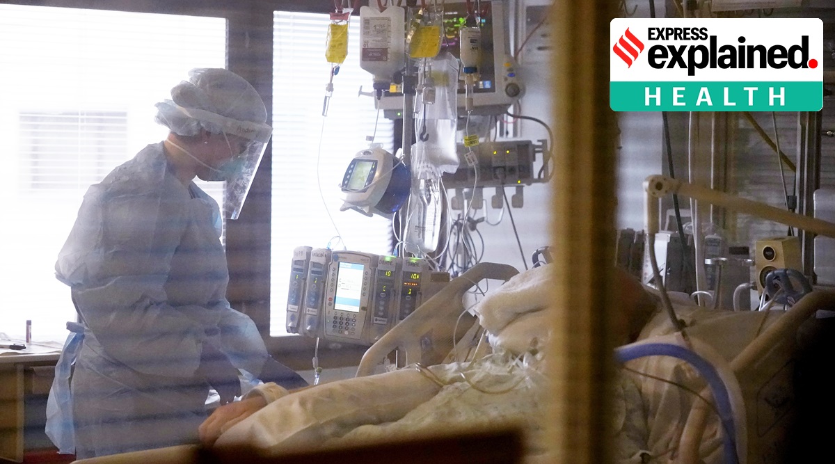 A nurse treats a patient in the Covid-19 intensive care unit at a hospital in Seattle. (AP Photo: Elaine Thompson, File)