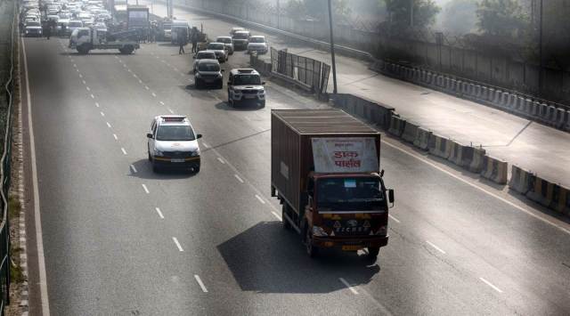 A truck with the first batch of Serum Institute of India’s Covishield vaccine passes through a green corridor on its way from IGI airport to  Rajiv Gandhi Super Specialty Hospital in New Delhi Tuesday. (Express photo by Tashi Tobgyal) 