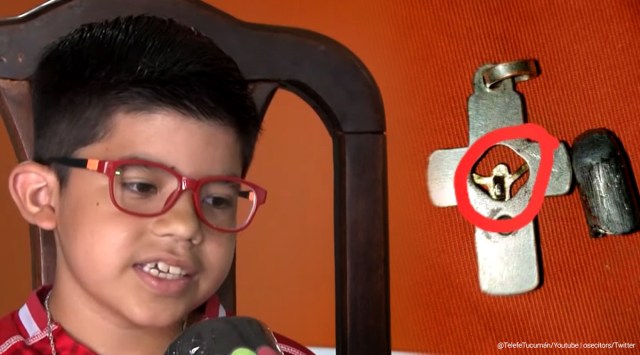 crucifix saves boy, crucifix stops bullet, boy saved from bullet by crucifix, argentona boy bullet saved crucifix, good news, odd news, indian express