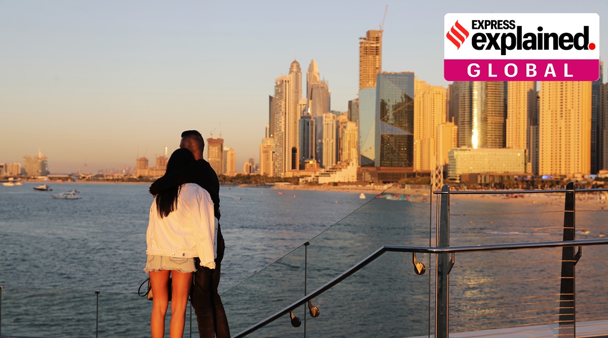 A couple looks at the skyline at sunset, in Dubai, United Arab Emirates, Tuesday, Jan. 12, 2021. (AP Photo: Kamran Jebreili, File)