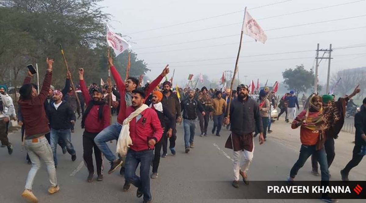 Watch video: Farmers break police barricades to enter Delhi