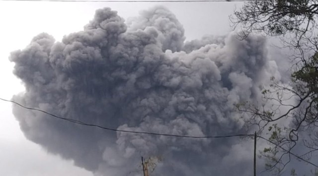 In this photo released by Indonesia's National Disaster Mitigation Agency (BNPB) Mount Semeru spews volcanic material during an eruption in Lumajang, East Java, Indonesia, Saturday, Jan. 16, 2021.(National Disaster Mitigation Agency via AP)