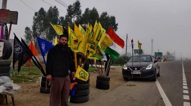 Jagdish Chand, who owns car repair workshop and a toy shop on Banga-Phagwara road, has now also started selling flags due to high demand. (Express photo by Navjeevan Gopal) 