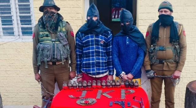 Police officials with arms and ammunitions recovered from the terror operatives.