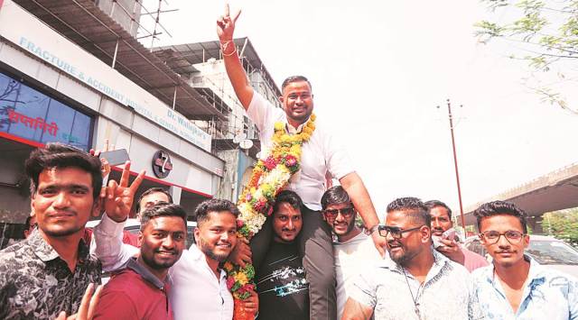 BJP’s Diwesh Bhagat celebrates after his win, at Panvel in Navi Mumbai. (Express photo by Narendra Vaskar)