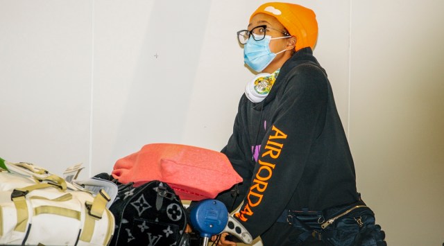 Japan's Naomi Osaka arrives at Adelaide Airport. Arriving players will serve a 14-day quarantine period ahead of the first Grand slam tennis tournament that is set to get underway in Melbourne. (AP Photo)