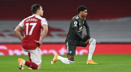 Manchester United's Marcus Rashford kneels in support of the Black Lives Matter campaign before the match (Source: Reuters)