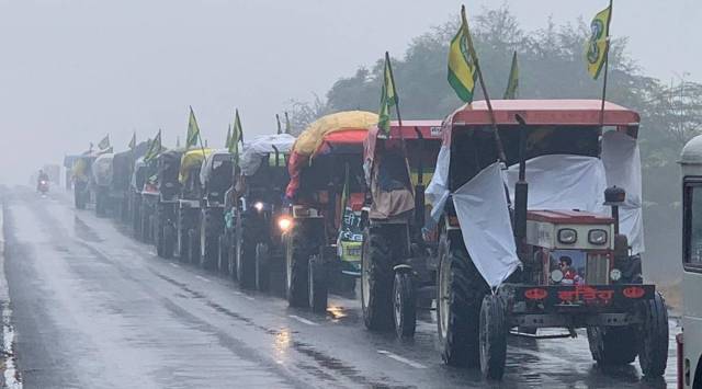 Tractor march from Rewari to Shahjahanpur on Sunday morning amid a downpour. 