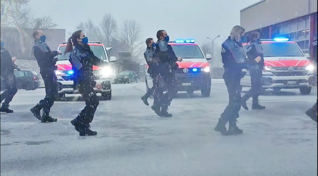 The members of the Swiss Federal Police in their various uniforms, including some in full riot gear, were seen dancing in car parks, on the streets and on top of tall buildings. (Source: ZugerPolizei/ Facebook)