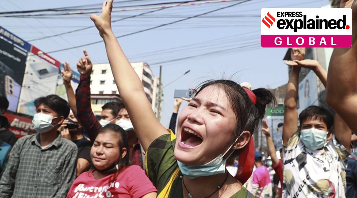 A protester shouts as she flashes the three-fingered salute during a protest rally in Yangon, Myanmar, on Feb. 6, 2021. (AP Photo)