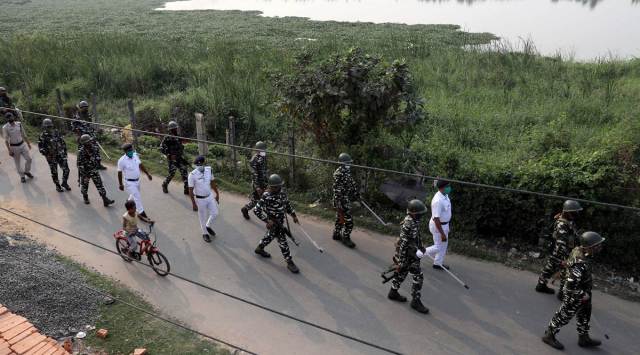 Central forces on a route march through Chainavi in Salt Lake, Kolkata, Sunday. (Express photo by Partha Paul)
