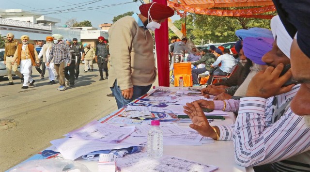 Punjab Health Minister Balbir Sidhu (left) during repolling at ward no 10 in Mohali, on Monday. (Express photo by Jasbir Malhi)