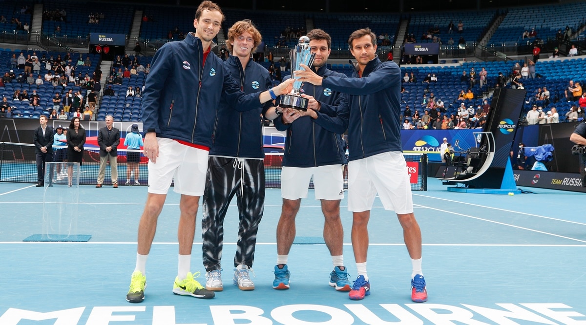 Daniil Medvedev of Russia, right, poses after winning the final