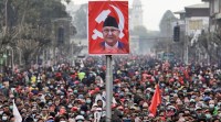 Pro-government activists take part in a mass gathering in support of Nepal’s Prime Minister, after the dissolution of parliament in Kathmandu no alt set