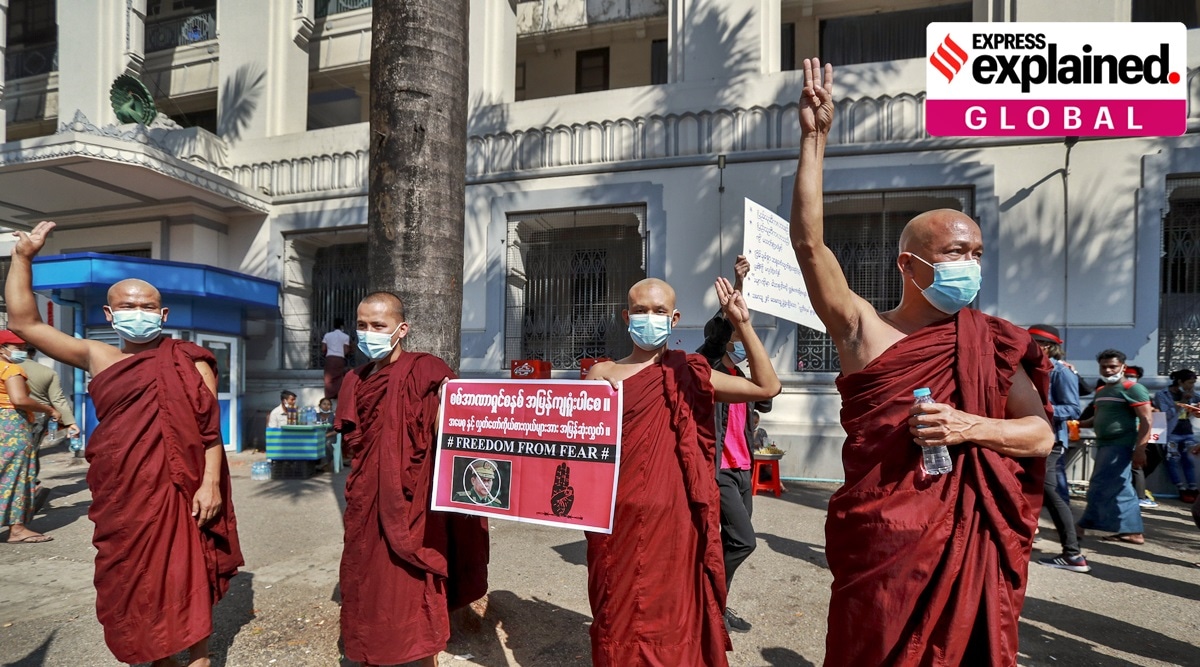 Buddhist monks flash three-fingered defiance salute during a protest against the military coup in Yangon, Myanmar, Wednesday, Feb. 10, 2021. (AP)