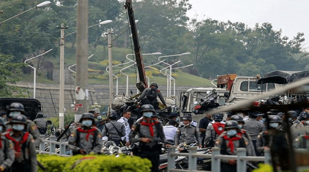 Policemen load motor bicycles belong to anti-coup demonstrators in Naypyitaw, Myanmar on Thursday, Feb. 18, 2021. (AP Photo)
