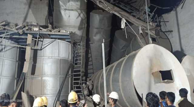 A team of National Disaster (NDRF) and Morbi fire brigade are trying to rescue a third person believed to be trapped under the debris. (Express Photo)