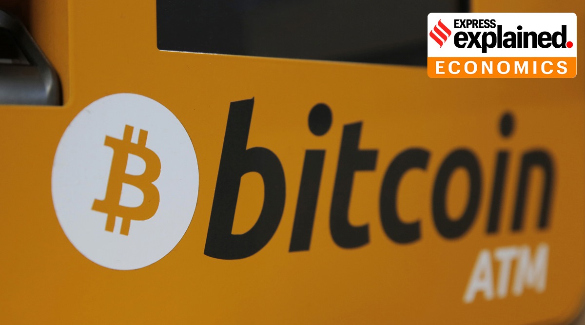 At ATM in Hong Kong displays the Bitcoin logo. Tesla says it has invested more than $1 billion in Bitcoin and will accept the digital currency as payment for its electric vehicles. In a regulatory filing Monday.  (File/AP Photo)