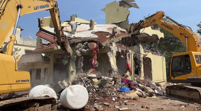 Bhojne said a staff of 150, which includes civic officials and police officers, is demolishing the illegal structures. (Express photo: Rajesh Stephen)