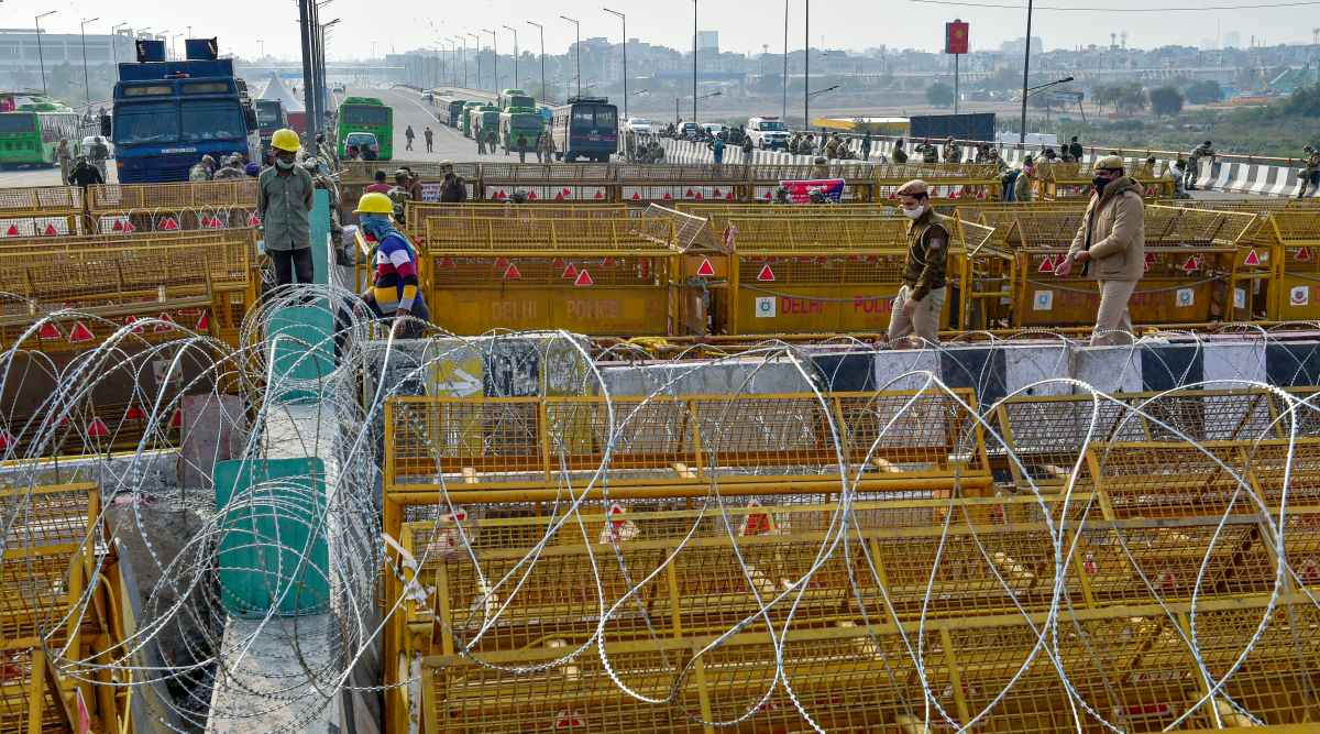 Police barricading at Ghazipur Border to stop farmers from entering the national capital during their protest against the new farm law, in New Delhi, Thursday, Feb. 4, 2021. (PTI Photo: Vijay Verma) 