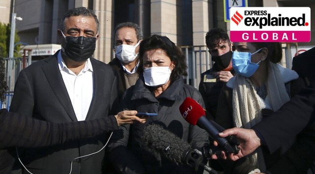 Ayse Bugra, center, an emeritus professor at the Bogazici University and wife of imprisoned Turkish philanthropist and human rights defender Osman Kavala, who has been in prison for more than three years on charges of espionage and attempting to overthrow the government, talks to media outside a court in Istanbul. (AP Photo/Emrah Gurel)